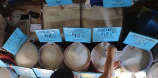 A vendor tends to her rice stall at the Paco Market in Paco, Manila. ALAMY