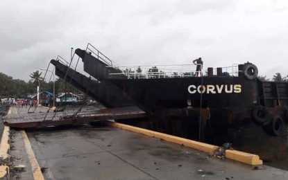 San Jose de Buenavista Fish Port Barge A barge moored near San Jose de Buenavista Fish Port on Tuesday afternoon, July 16 damages utility poles. The Philippine Coast Guard Antique Station advised residents to temporarily evacuate because of the danger posed by the drifting barge “Corvus.” PNA