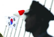 SoKor rejects Japan’s call for arbitration A police officer stands guard near Japanese and South Korean national flags at a hotel, where the South Korean embassy in Japan is holding a reception to mark the 50th anniversary of the normalization of ties between Seoul and Tokyo, in Tokyo, June 22, 2015. REUTERS