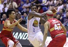 TNT KaTropa’s Terrence Jones hangs on to the leather while being defended by Barangay Ginebra San Miguel Kings’ Aljon Mariano and Mark Caguioa. PBA PHOTO