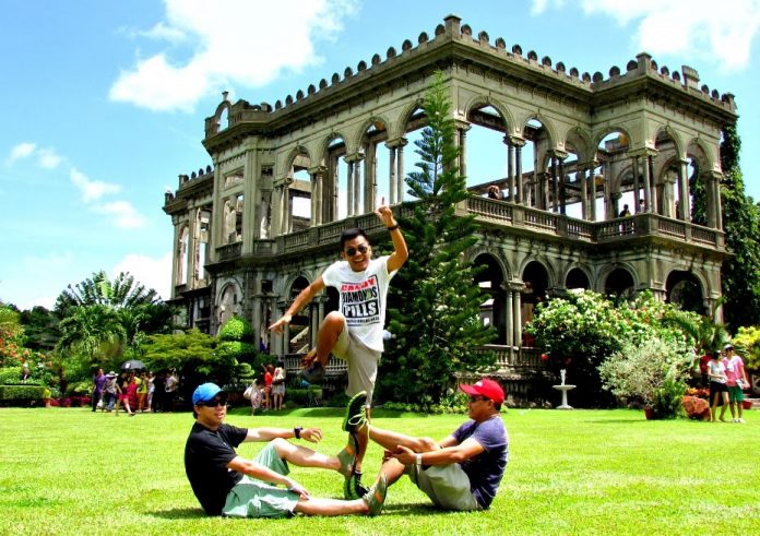 The Ruins in Talisay City, Negros Occidental Tourists are seen having their unique souvenir photo taken in front of the façade of The Ruins in Talisay City, Negros Occidental – a popular tourist destination north of Bacolod City. FROM LOVEMINDANAO.COM