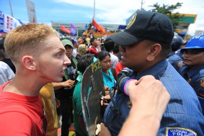 Thomas van Beersum Dutch activist Thomas van Beersum confronts Filipino police officer Joselito Sevilla, who broke into tears amid a dispersal of protesters outside Batasang Pambansa during the State of the Nation Address in 2013. The foreigner was later deported. ABS-CBN NEWS