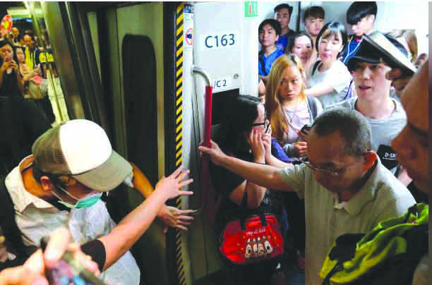 World Hongkong Anti-extradition bill demonstrators block the Mass Transit Railway (MTR) train in Hong Kong, China July 30, 2019. REUTERS