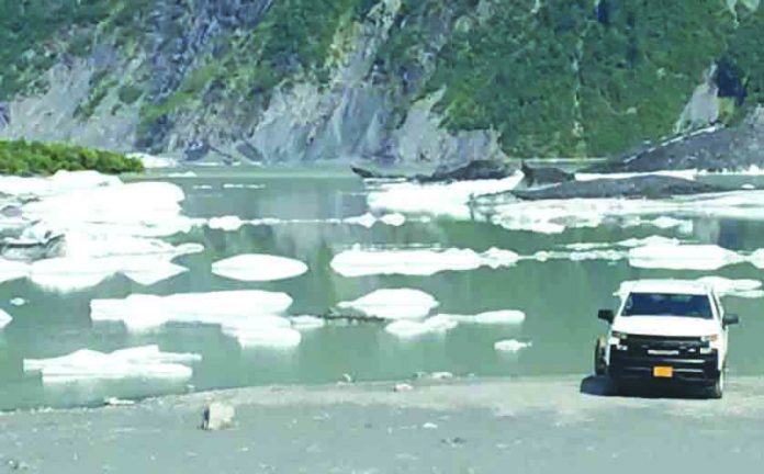 Scene of Valdez Fire Department conducting investigation into three found dead after a guided kayak trip accident in the icy waters of a glacier-fed lake in Alaska, USA, July 30, 2019. KTVA