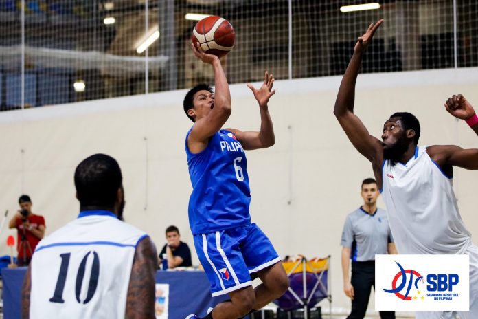 The Philippines’ Andy Mark Barroca attempts a floater against Congolese defenders. CIGNAL-SBP PHOTO