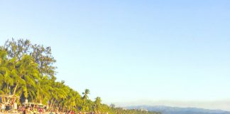 Tourists enjoy the world-famous white sand beach of Boracay Island in Malay, Aklan. In July this year, international website, Travel, included the famed-island resort in the top three most crowded destinations in the world. BOY RYAN ZABAL/AKEAN FORUM