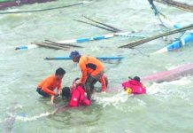 Search and rescue personnel retrieve the body of a passenger of one of three capsized motorboats, near the Dumangas port between Iloilo and Negros Occidental on Aug. 4. OFFICE OF CIVIL DEFENSE 6