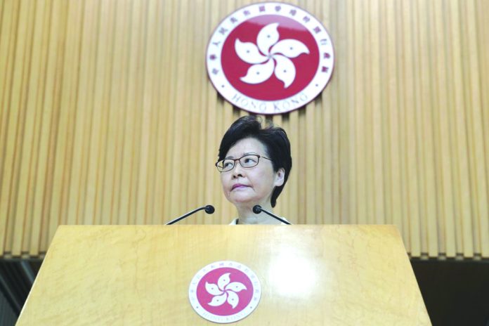 Carrie Lam Listens Hong Kong Chief Executive Carrie Lam Listens to reporters' questions during a press conference in Hong Kong Tuesday, Aug. 27, 2019. AP