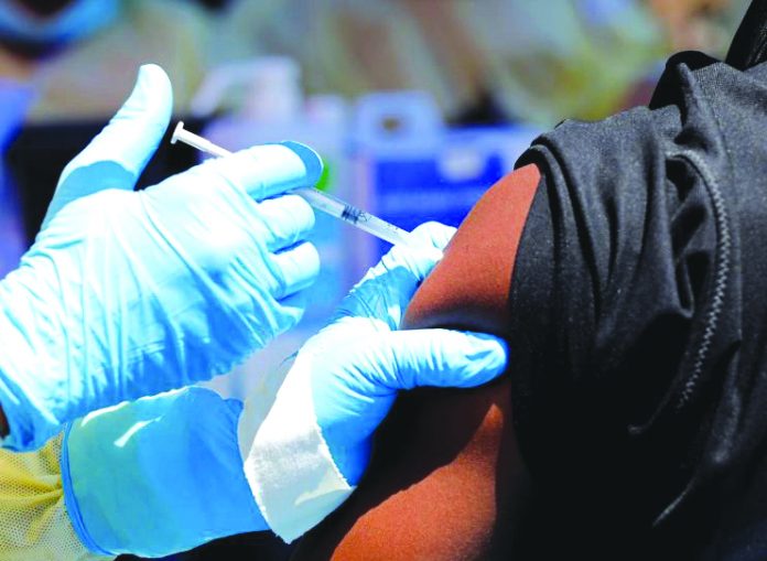 A health worker injects a man with Ebola vaccine in Goma, Democratic Republic of Congo, Aug. 5, 2019. REUTERS