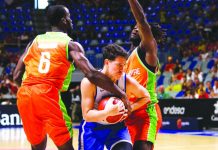 Gilas repeats over Ivory Coast in Spain Gilas Pilipinas’ Robert Bolick Jr. tightened his grip on the ball after being trapped by two Ivory Coast defenders. PHOTO COURTESY OF CIGNAL-SBP