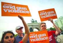 US mass shootings ignite new calls for gun legislation People gather for a vigil to remember victims of the mass shootings at Dayton and El Paso, at Grand Army Plaza in Brooklyn, New York, U.S., August 5, 2019. REUTERS