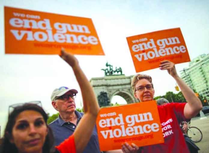 People gather for a vigil to remember victims of the mass shootings at Dayton and El Paso, at Grand Army Plaza in Brooklyn, New York, U.S., August 5, 2019. REUTERS