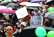 Hong Kong braces for another weekend of protests Family members participate in a protest rally titled “Guard Our Children's Future” at Edinburgh Place in Hong Kong, China, August 10, 2019. REUTERS