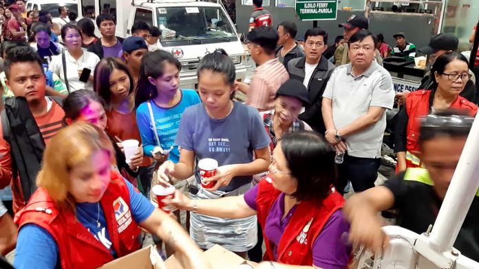 Iloilo Strait Tragedy Survivors of Aug. 3, 2019’s sea mishap at the Iloilo Strait are being provided with food by the Iloilo City government at the Iloilo Ferry Terminal-Parola. Mayor Jerry Treñas (standing, second from right) oversees the activity.