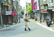 Troops lock down Kashmir as India votes to strip its status An Indian paramilitary soldier guards during security lockdown in Jammu, India, Tuesday, Aug.6, 2019. AP