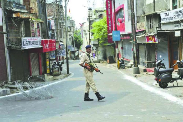 Indian paramilitary soldier An Indian paramilitary soldier guards during security lockdown in Jammu, India, Tuesday, Aug.6, 2019. AP