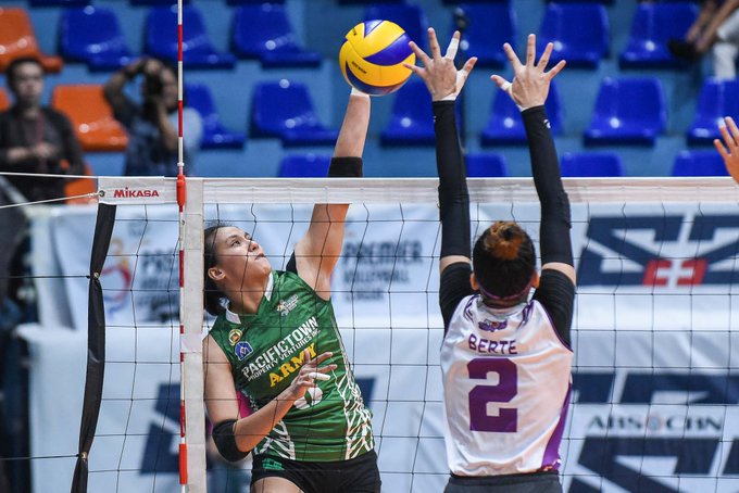 Jovelyn Gonzaga Jovelyn Gonzaga of PacificTown-Army Lady Troopers fires a shot against a Choco Mucho Flying Titans defender. TIEBREAKER TIMES PHOTO