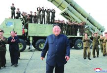 N. Korea tests new ‘super-large’ rocket launcher This shows North Korean leader Kim Jong Un, center, smiles after the test firing of an unspecified missile at an undisclosed location in North Korea on Aug. 24, 2019. KOREAN CENTRAL NEWS AGENCY/KOREA NEWS SERVICE VIA AP