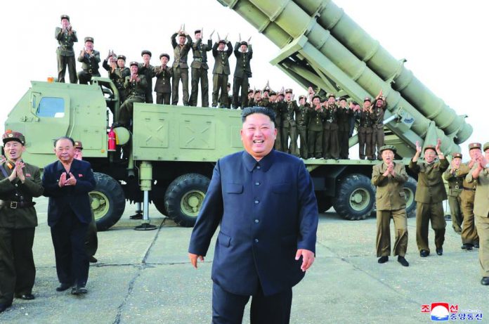Kim Jong Un This shows North Korean leader Kim Jong Un, center, smiles after the test firing of an unspecified missile at an undisclosed location in North Korea on Aug. 24, 2019. KOREAN CENTRAL NEWS AGENCY/KOREA NEWS SERVICE VIA AP