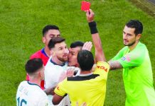 Messi banned from football for 3 months Lionel Messi of Argentina is shown a red card in the 37th minute against Chile, following a clash at the Copa America. REUTERS
