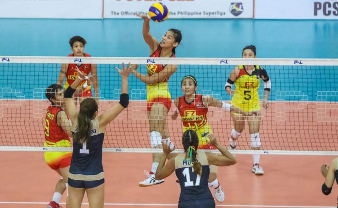 Mary Joy Baron F2 Logistics Cargo Movers’ Mary Joy Baron dumps the ball against the defense of Cignal HD Spikers’ Jannine Navarro and Ranya Musa. PSL PHOTO
