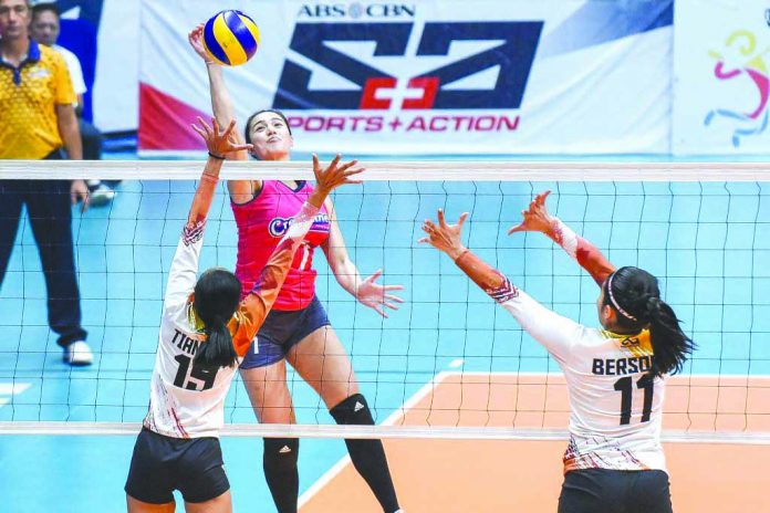 Michelle Gumabao Creamline Cool Smashers’ Michelle Gumabao scores against a BanKo-Perlas Lady Spikers defender. SPORTS VISION PHOTO
