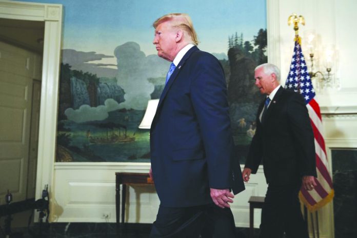 Mike Pence and President Donald Trump Vice President Mike Pence follows President Donald Trump as he walks off after speaking about the mass shootings in El Paso, Texas and Dayton, Ohio, in the Diplomatic Reception Room of the White House, Monday, Aug. 5, 2019, in Washington. AP