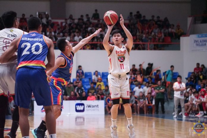Nico Paolo Javelona of Bacolod Master Sardines pulls up for a basket as Caloocan Supremos’ Ranbill Tongco tries to defend. MPBL PHOTO