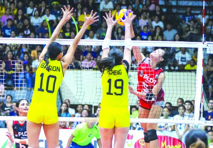 PLDT Home Fibr Power Hitters’ Gretchel Soltones PLDT Home Fibr Power Hitters’ Gretchel Soltones attempts to score against F2 Logistics Cargo Movers’ Desiree Cheng. PSL PHOTO
