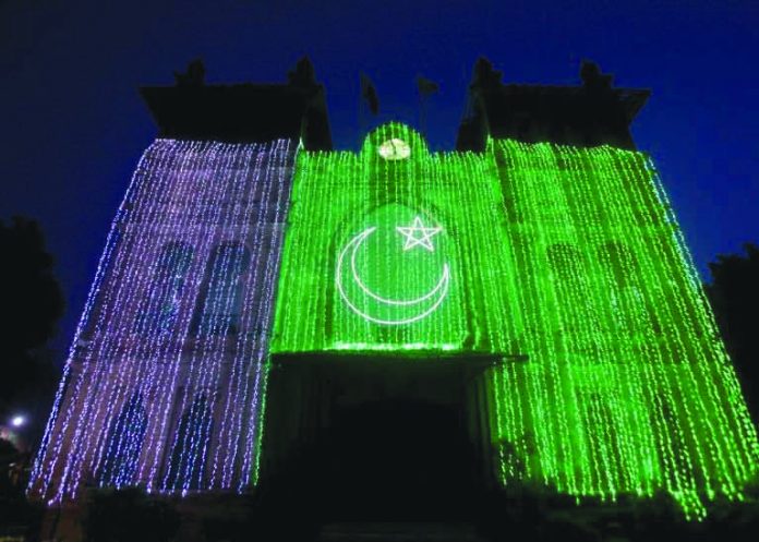 A general view of the Metropolitan building illuminated with national flag, ahead of Pakistan's Independence Day in Lahore, Pakistan Aug. 13, 2019. REUTERS