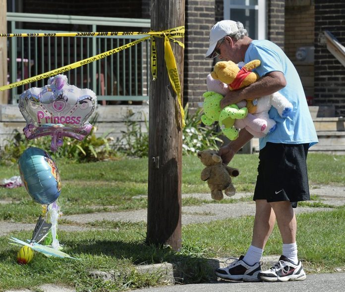 Paul Laughlin Paul Laughlin, 57, places stuffed animals on Sunday, Aug. 11, 2019 outside a home at 1248 West 11th St. in Erie, Pa., where multiple people died in an early-morning fire. TIMES-NEWS VIA AP