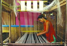 A woman loom-weaves piña fiber in Kalibo, Aklan. “Piña” fiber is extracted from the leaves of a pineapple plant. The fibers are ivory-white in color and naturally glossy. The cloth is translucent, soft and fine with high luster. PHILIPPINE FOLKLIFE MUSEUM FOUNDATION