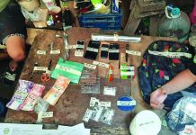 Operatives of the Philippine Drug Enforcement Agency seize these suspected shabu, cellphones, marked money, and drug paraphernalia in San Carlos City, Negros Occidental. PDEA REGION 6