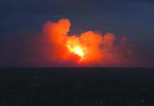 Russian arms depot in Siberia explodes A view shows flame and smoke rising from the site of blasts at an ammunition depot near the town of Achinsk in Krasnoyarsk region, Russia August 5, 2019. REUTERS