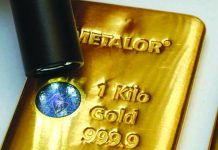 The Sicpa Oasis validator system (bullion protect) is pictured on one kilogram bar of gold at Swiss refiner Metalor in Marin near Neuchatel, Switzerland July 5, 2019. REUTERS