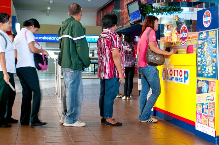 Playing Lotto After almost a month, President Rodrigo Duterte lifts the suspension of Small Town Lottery in the country but with implementing rules and regulations. BUSINESS MIRROR