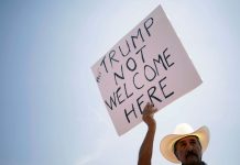 Protesters cry foul as Trump visits mass shooting victims A man takes part in a rally against the visit of the U.S. President Donald Trump after a mass shooting at a Walmart store, in El Paso, Texas, U.S., Aug. 7, 2019. REUTERS