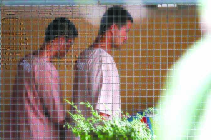 World Thai Myanmar migrant workers Zaw Lin and Win Zaw Htun arrive at the Nonthaburi provincial court in Thailand, Aug. 29, 2019. REUTERS