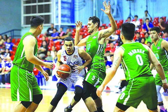 Aaron Black Aaron Black of AMA Online Education Titans extricates himself against the Hazchem Green Warriors defenders. PBA PHOTO