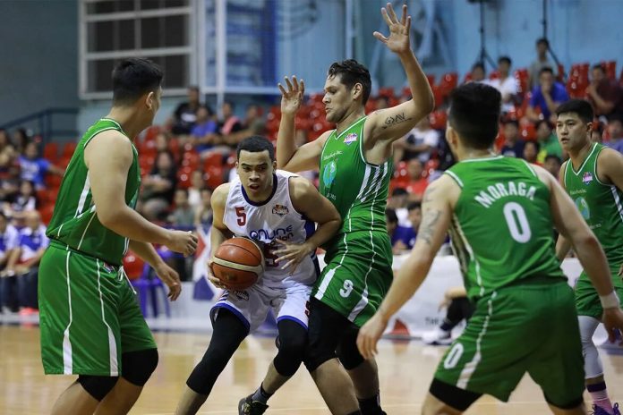 Aaron Black Aaron Black of AMA Online Education Titans extricates himself against the Hazchem Green Warriors defenders. PBA PHOTO