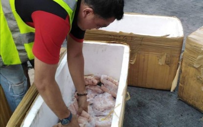 African Swine Fever Task Force A member of the Provincial African Swine Fever Task Force prepares to ship back pork products from Luzon that arrived at the Bacolod Bredco Port on Sept. 25. NEGOCC PROVINCIAL ASF TASK FORCE