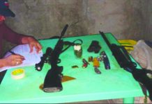 Barotac Viejo man yields guns, grenade An officer of the police station in Barotac Viejo, Iloilo checks firearms confiscated from Cristobal Debil. BAROTAC VIEJO MPS
