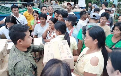 Hundreds of residents of two remote villages in Escalante City, Negros Occidental receive assistance from the Philippine Army and the city government. PHOTO COURTESY OF 79IB, PHILIPPINE ARMY