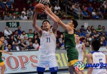 Ateneo Blue Eagles’ George Isaac Go is clobbered by a Far Eastern University Tamaraws defender while trying to go for an inside basket. UAAP PHOTO