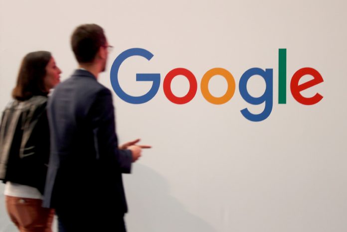 Google Visitors pass by the logo of Google at the high profile startups and high tech leaders gathering, Viva Tech, in Paris, France May 16, 2019. REUTERS