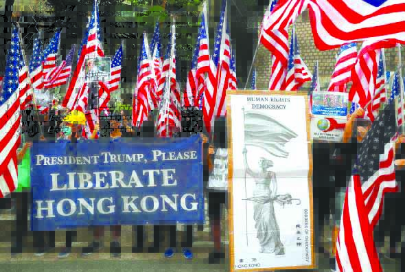 HK Protesters Protesters hold signs and U.S. flags during a rally in Hong Kong, China on Sept. 8, 2019. REUTERS