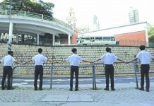 Hong Kong tells US to stay out Students hold hands to surround St. Paul's College in Hong Kong, Monday, Sept. 9, 2019. AP