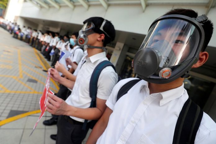 Hong Kong, China Secondary school students wearing masks join a human chain protesting against what they say is police brutality against protesters, after clashes at Wan Chai district in Hong Kong, China Sept. 9, 2019. AMR ABDALLAH DALSH/REUTERS
