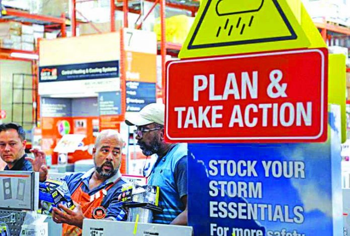 Hurricane Dorian A worker at Home Depot helps customers with storm supplies as people rushed to stock up on necessities ahead of the arrival of Hurricane Dorian in Kissimmee, Florida, U.S. Aug. 30, 2019.