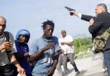 Haiti senator opens fire, injures 2 Sen. Jean Marie Ralph Féthière (right) opens fire as he left parliament in the capital Port-au-Prince on Monday, wounding two people. REUTERS